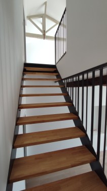 Escalier fer bois quart tournant / Limons latéraux courbés / Finition fer brut patiné